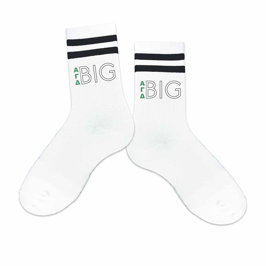 Big and little Alpha Gamma Delta sorority greek letter design digitally printed on the outside of the black striped crew socks.