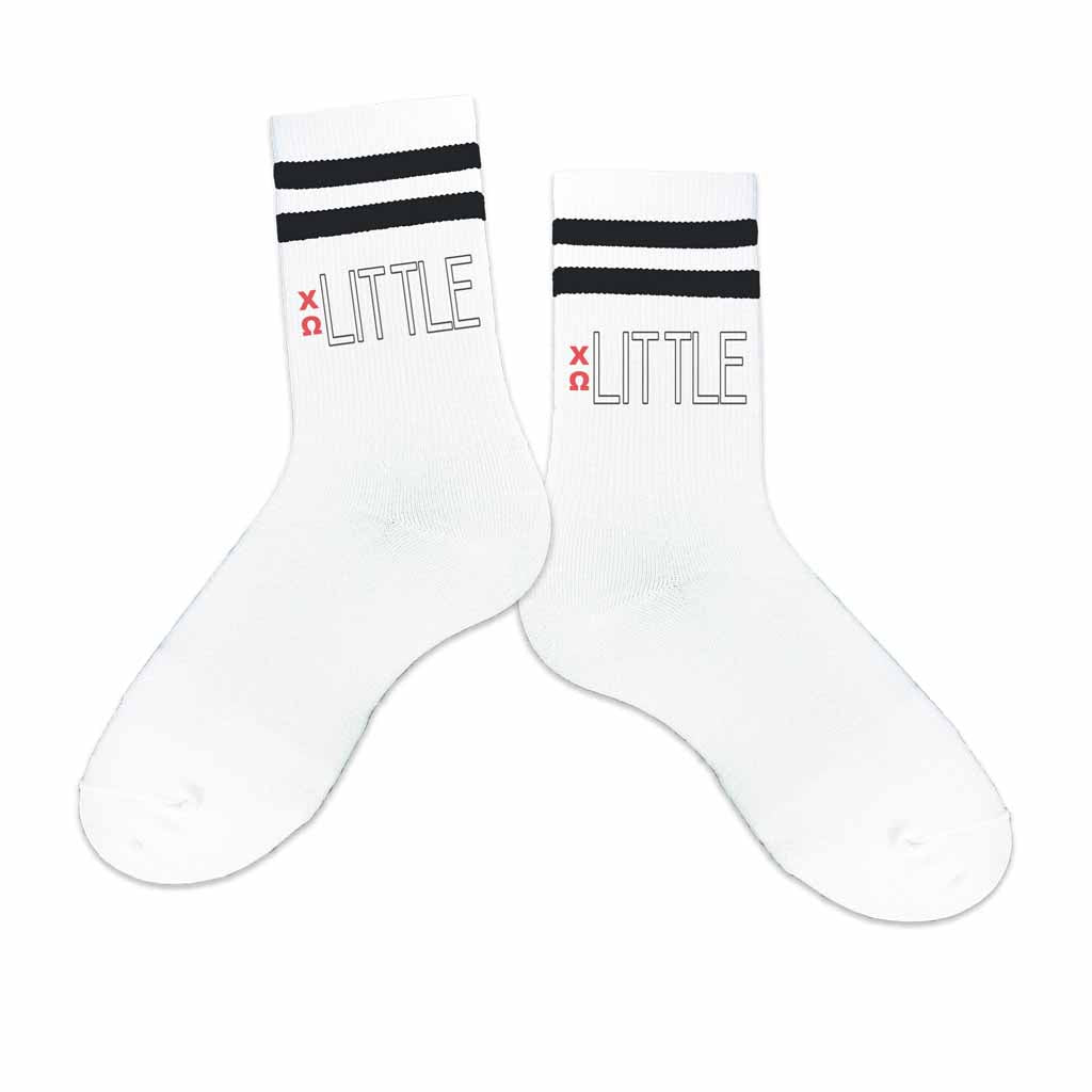 Big or little Chi Omega Greek letters printed on the outside of the black striped cotton crew socks.