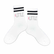 Big or little Delta Zeta Greek letters digitally printed on the outside of black striped crew socks.