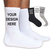 White customizable unisex crew socks worn by a model, showcasing a printed design; also available in black and heather gray with sizes medium to x-large.