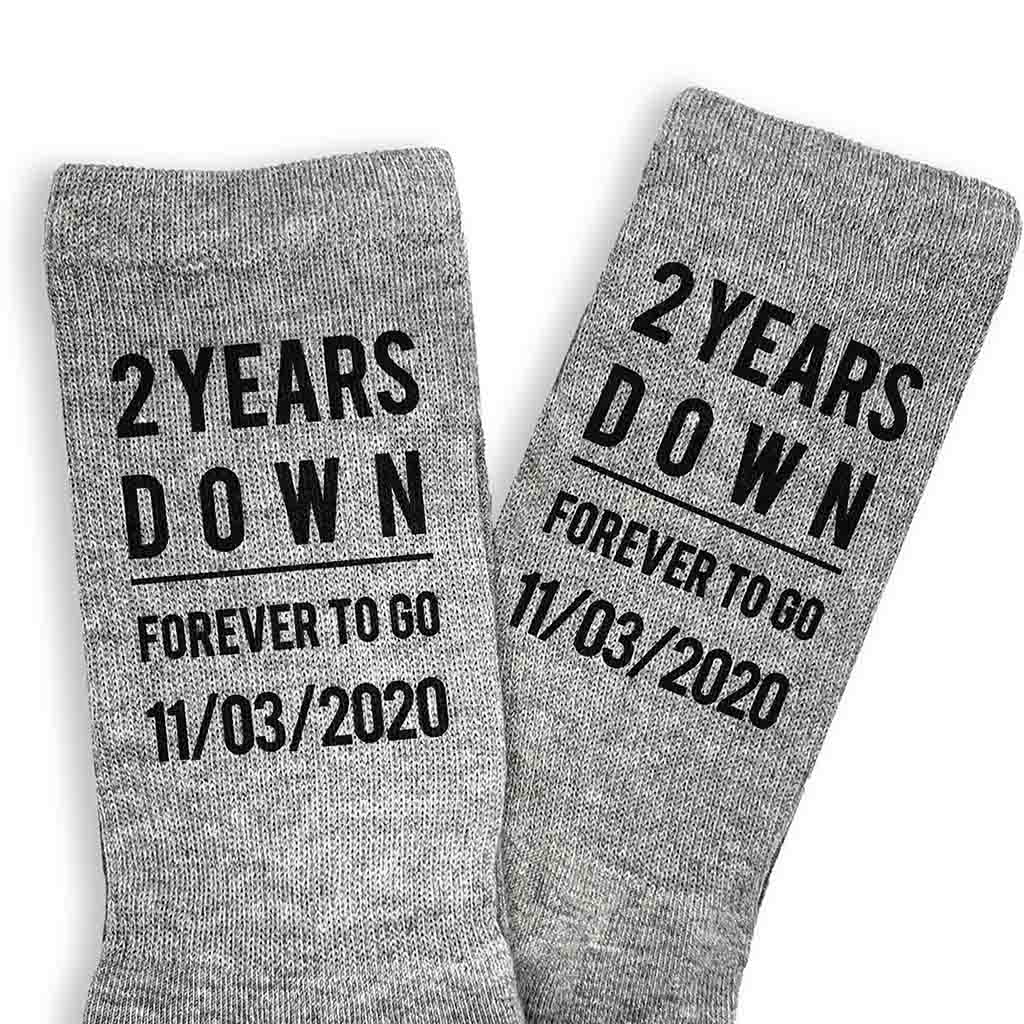 Celebrate a two year anniversary with personalized cotton socks for him digitally printed in black ink on the sides of the ribbed crew socks.