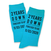 Turquoise flat knit cotton dress socks custom printed with two years down and forever to go and personalized with your wedding date printed on the sides of the socks make a great gift for your gift of cotton on your second anniversary.