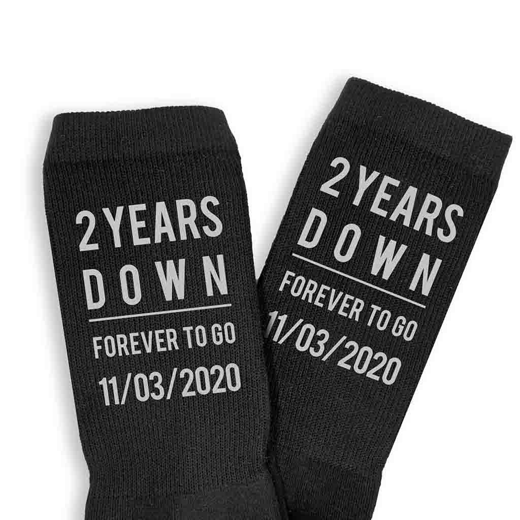 Celebrate a two year anniversary with personalized cotton socks for him digitally printed in black ink on the sides of the ribbed crew socks.