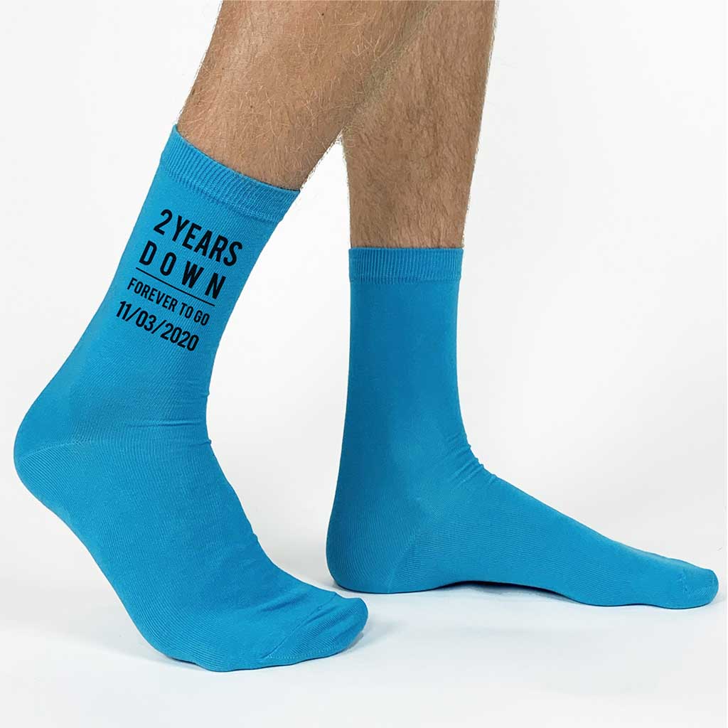 Turquoise flat knit cotton dress socks custom printed with two years down and forever to go and personalized with your wedding date printed on the sides of the socks make a great gift for your gift of cotton on your second anniversary.