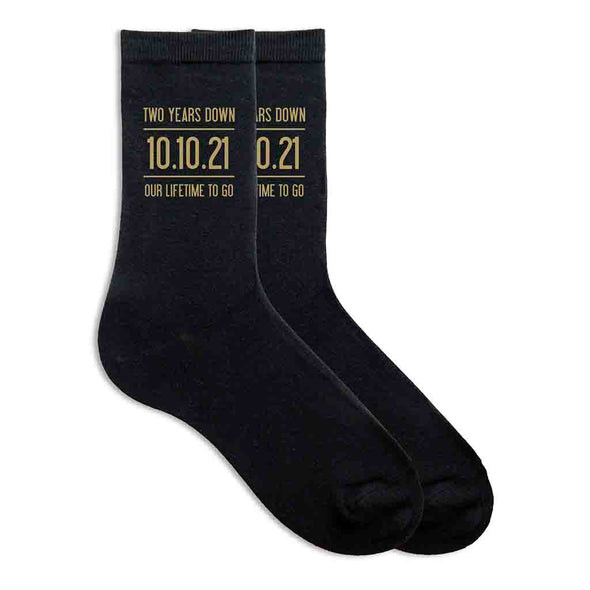 Two years down our lifetime to go digitally printed in gold ink personalized with your wedding date on cotton socks.