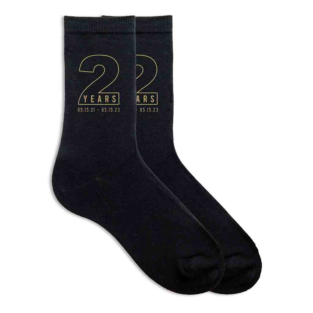 Personalized two year anniversary socks for your spouse with gold ink.