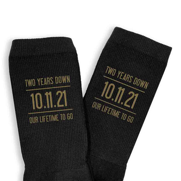 Two years down our lifetime to go digitally printed in gold ink personalized with your wedding date on cotton socks.