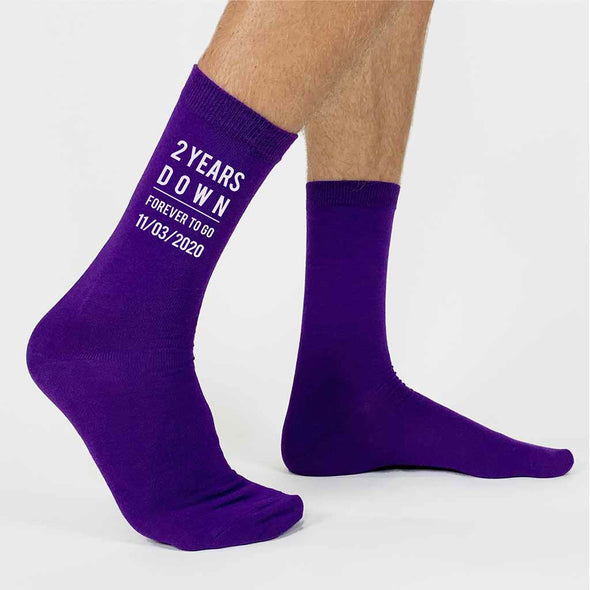 Celebrate a two year anniversary with personalized purple cotton socks for your special person to celebrate two years with the gift of cotton and custom printed two years down and forever to go and your wedding date digitally printed in white ink on the sides of purple dress socks.
