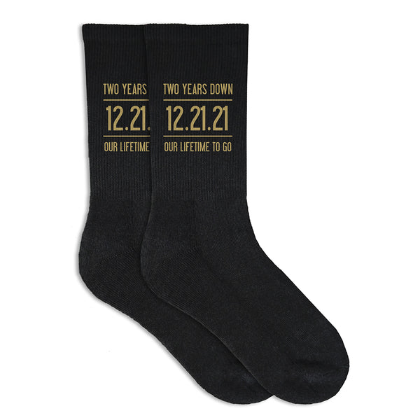 Two years down our lifetime to go digitally printed in gold ink personalized with your wedding date on cotton socks.