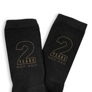 Personalized two year anniversary socks for your spouse with gold ink.