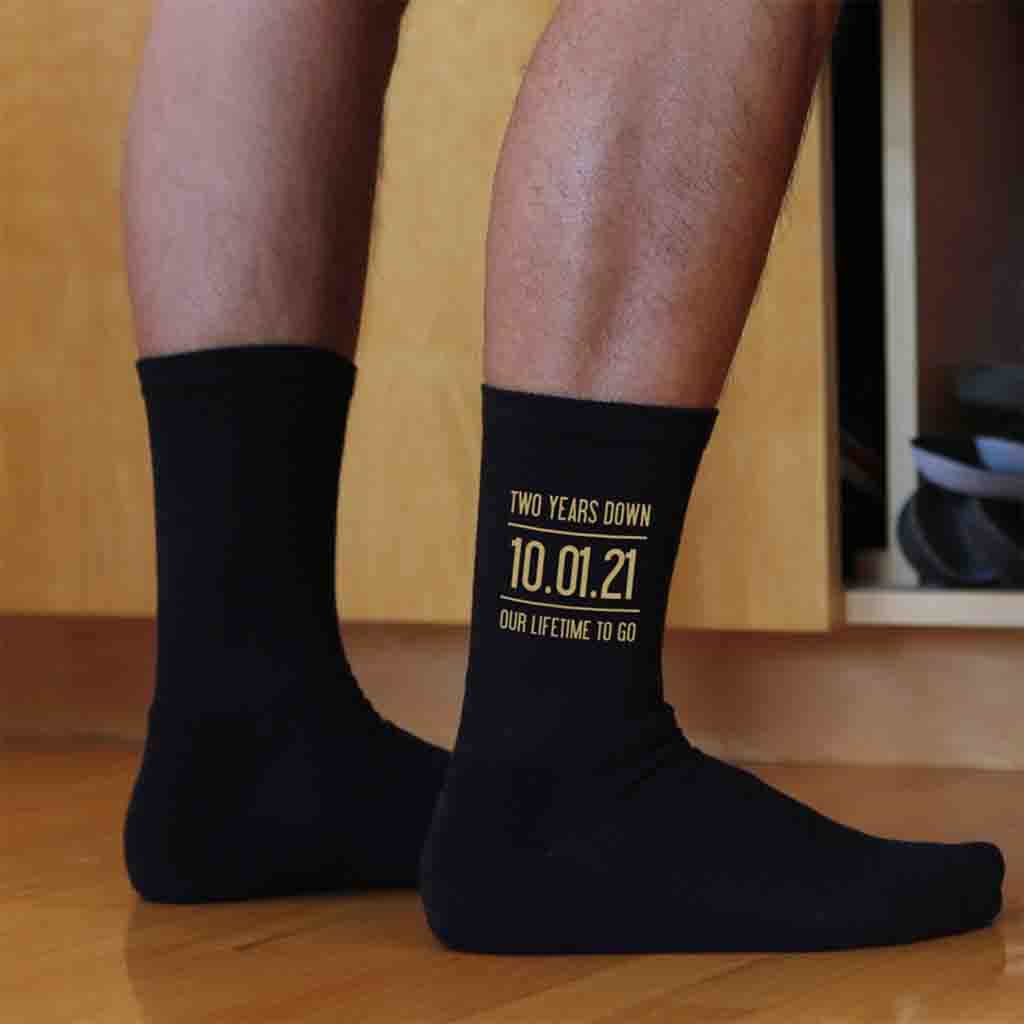 Two years down our lifetime to go digitally printed in gold ink personalized with your wedding date on cotton socks.