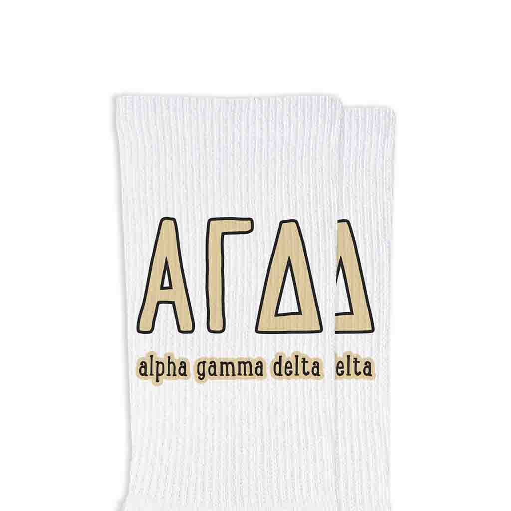 Alpha Gamma Delta sorority name and letters digitally printed on white crew socks.