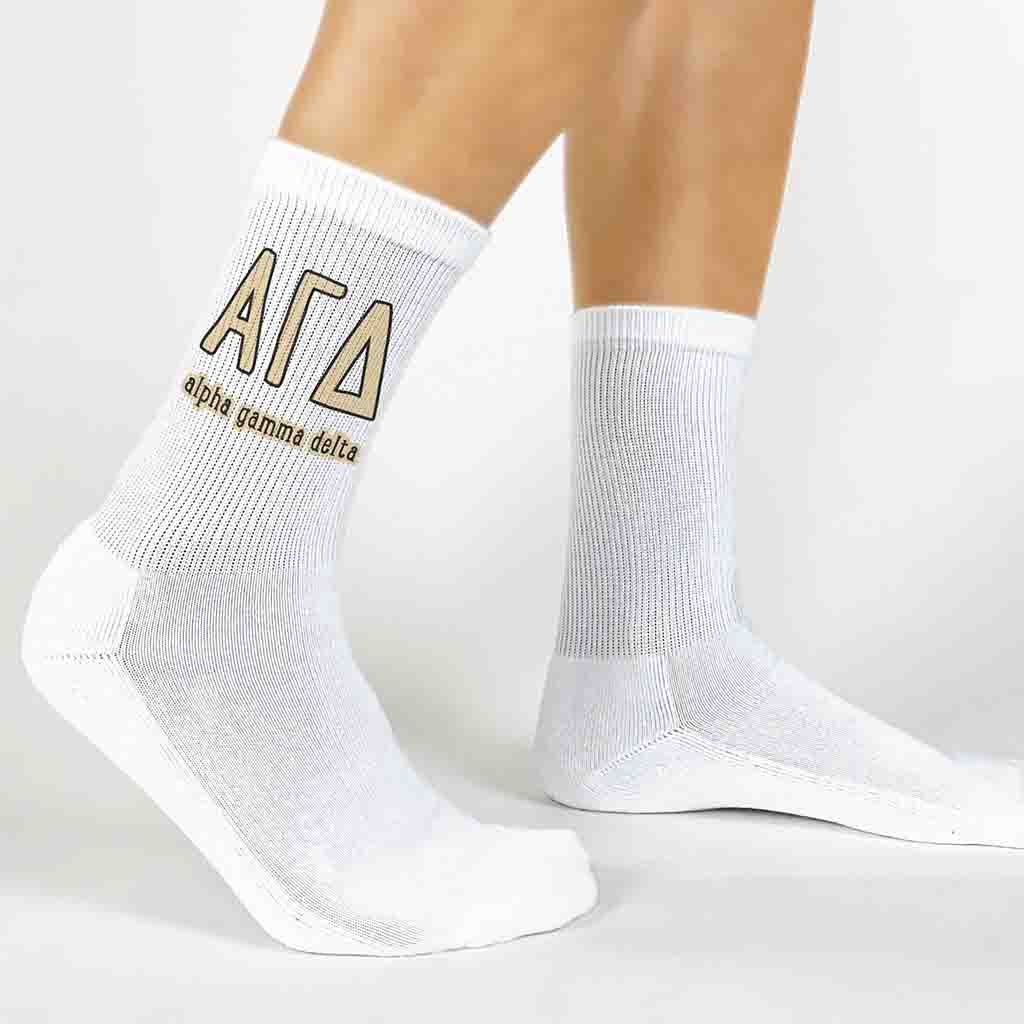 Alpha Gamma Delta sorority name and letters digitally printed on white crew socks.