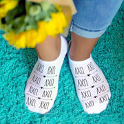 AXO sorority letters custom printed on white cotton crew socks.