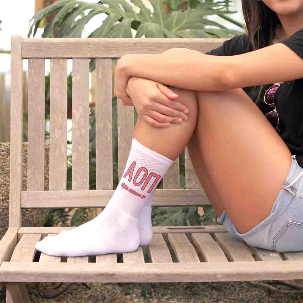 Alpha Omicron Pi sorority name and letters digitally printed on white crew socks.