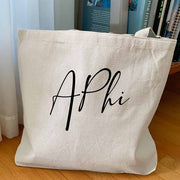 Alpha Phi sorority nickname custom printed in script writing on canvas tote bag is a unique gift for all your sorority sisters.