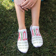 Alpha Chi Omega sorority letters and name digitally printed in sorority colors on white no show socks.