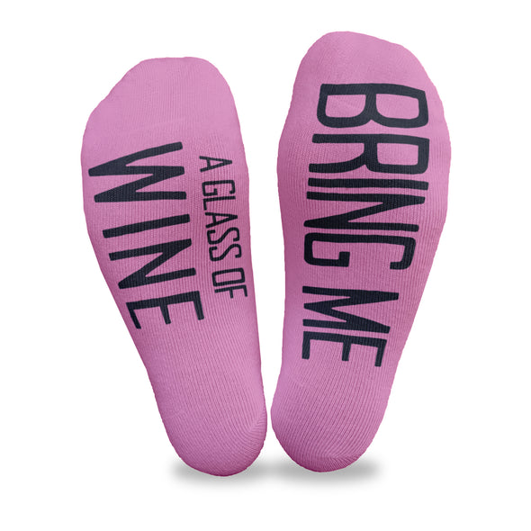 Women's no show fuchsia footie socks custom printed with text on the soles that read bring me a glass of wine make a fun gift for your best friend.