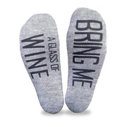 Bring me a glass of wine custom printed on the bottom soles of heather gray cotton no show socks is a great way to get your loved one to bring you a drink.
