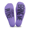 Bring me a glass of wine custom printed on the soles of purple no show socks makes a fun statement to your friends on game night.