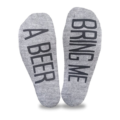 Bring me a beer custom printed in black ink on the bottoms of heather gray no show socks makes a fun gift to get your spouse to bring you a beer.