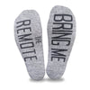 Bring me the remote custom printed in black ink on the bottom of heather gray cotton no show socks is a fun way to get your husband to bring you the remote.