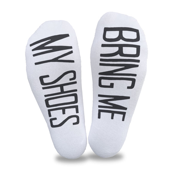 Bring me my shoes digitally printed in black ink on the bottoms of white cotton no show footie socks is a fun way to get your shoes when you don't want to get up.