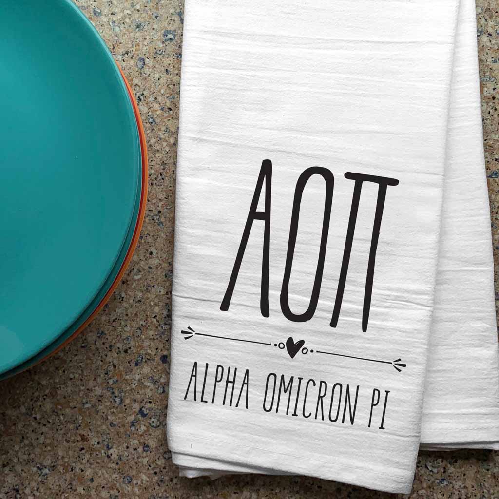 Alpha Omicron Pi sorority letters and name digitally printed in black ink boho style design on white cotton dishtowel.