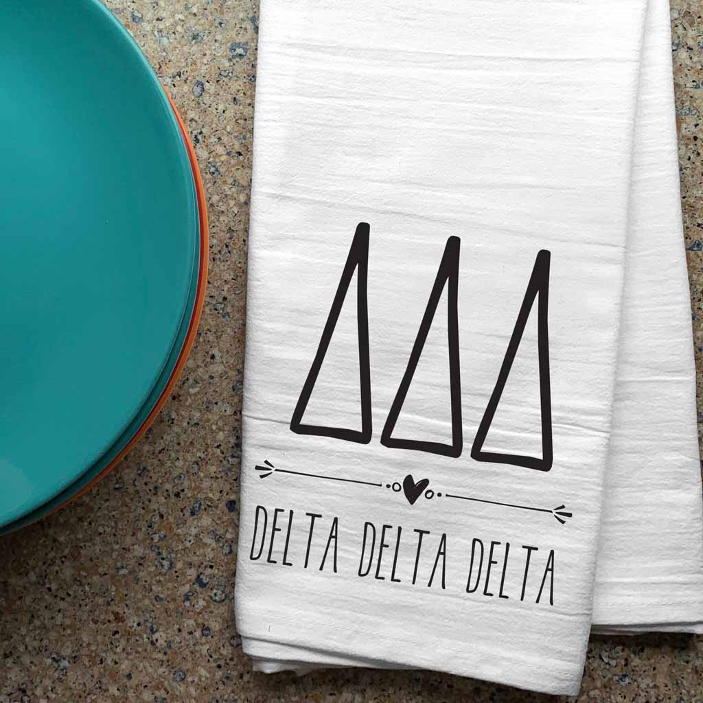 Tri Delta sorority letters and name digitally printed in black ink boho style design on white cotton dishtowel.
