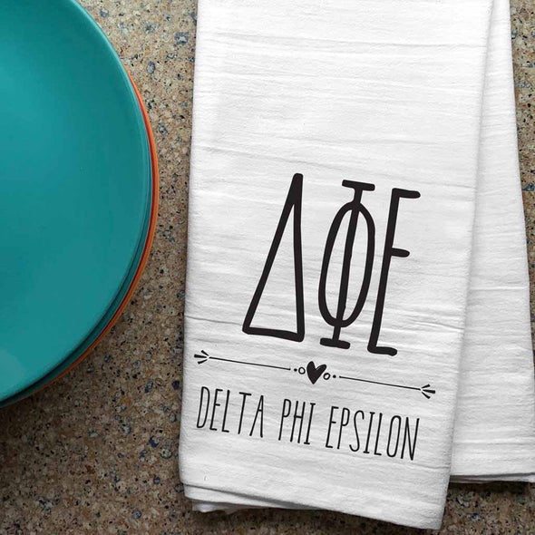Delta Phi Epsilon sorority letters and name digitally printed in black ink boho style design on white cotton dishtowel.