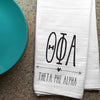 Theta Phi Alpha sorority letters and name digitally printed in black ink boho style design on white cotton dishtowel.