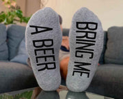 Bring me a beer custom printed on the bottom soles of heather gray no show socks.