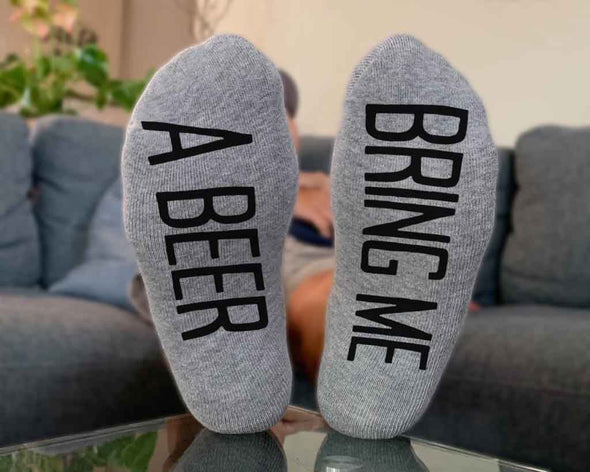 Bring me a beer custom printed on the bottom soles of heather gray no show socks.