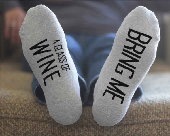 Bring me a glass of wine custom printed in black ink on the bottom soles of footie style no show socks make a fun night with your loved one.