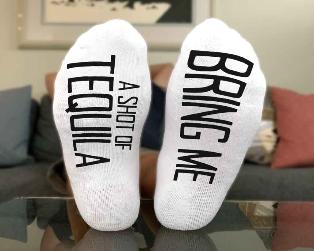 Bring me a shot of tequila custom printed on the bottom soles of the white cotton no show socks.