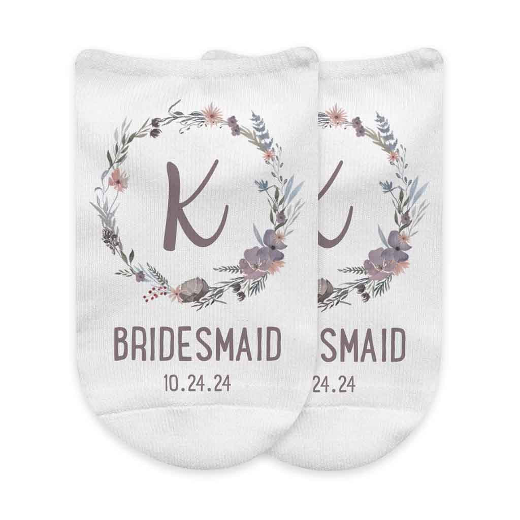 Super cute bridesmaid socks custom printed with a floral design personalized with your wedding date and role.
