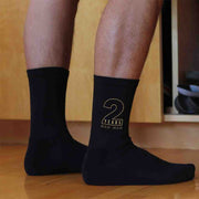 Personalized two year anniversary socks for your spouse with gold ink.