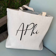 Alpha Phi sorority nickname digitally printed in script writing on canvas tote bag is the perfect accessory for your sorority sister.