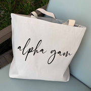 Alpha Gamma Delta sorority nickname digitally printed in script writing on canvas tote bag is the perfect accessory for your sorority sister.