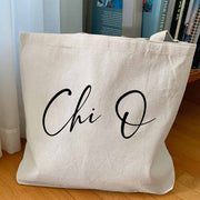 XO sorority nickname custom printed in script writing on canvas tote bag is a unique gift for all your sorority sisters.