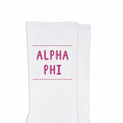 Alpha Phi sorority name design printed in sorority colors on comfy white cotton crew socks is the perfect gift for your sorority sisters.