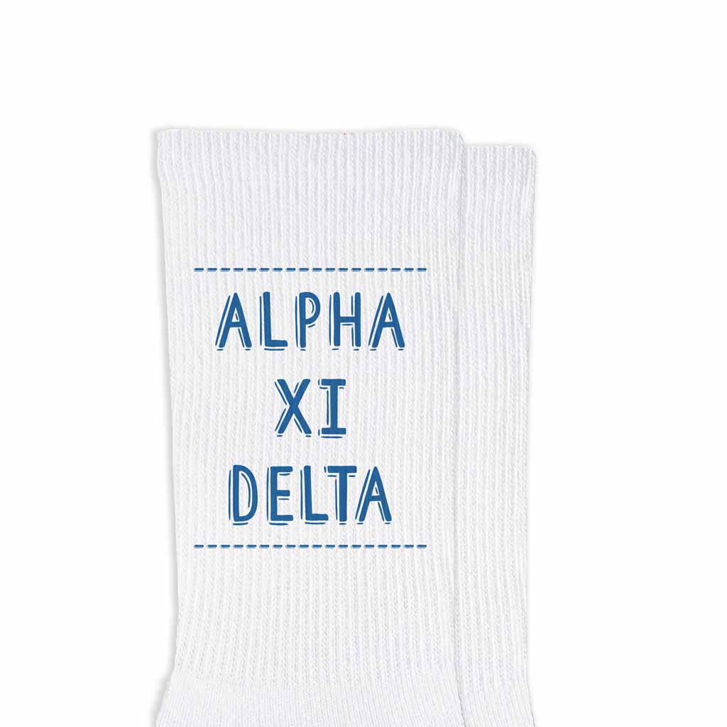 Alpha Xi Delta sorority name design printed in sorority colors on comfy white cotton crew socks is the perfect gift for your sorority sisters.