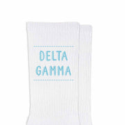 Delta Gamma sorority name design printed in sorority colors on comfy white cotton crew socks is the perfect gift for your sorority sisters.