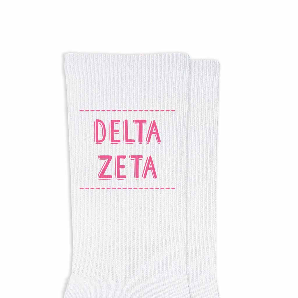 Delta Zeta sorority name design printed in sorority colors on comfy white cotton crew socks is the perfect gift for your sorority sisters.
