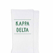 Kappa Delta sorority name design printed in sorority colors on comfy white cotton crew socks is the perfect gift for your sorority sisters.