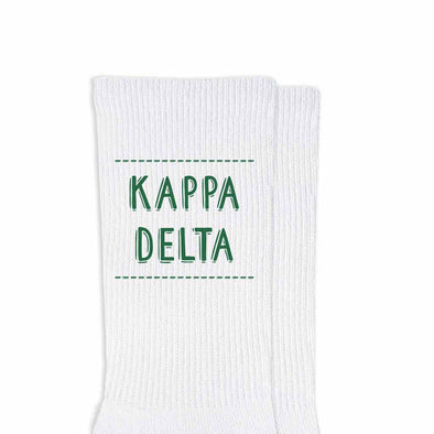 Kappa Delta sorority name design printed in sorority colors on comfy white cotton crew socks is the perfect gift for your sorority sisters.