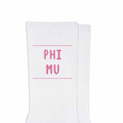 Phi Mu sorority name design printed in sorority colors on comfy white cotton crew socks is the perfect gift for your sorority sisters.
