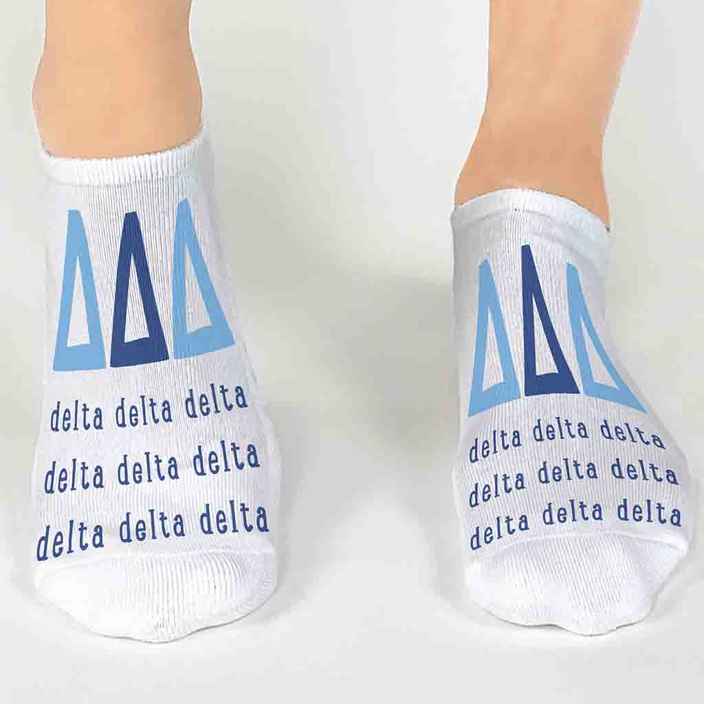 Tri Delta sorority letters and name digitally printed on white no show socks.