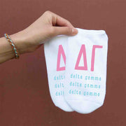 Delta Gamma sorority letters and name digitally printed on white no show socks.