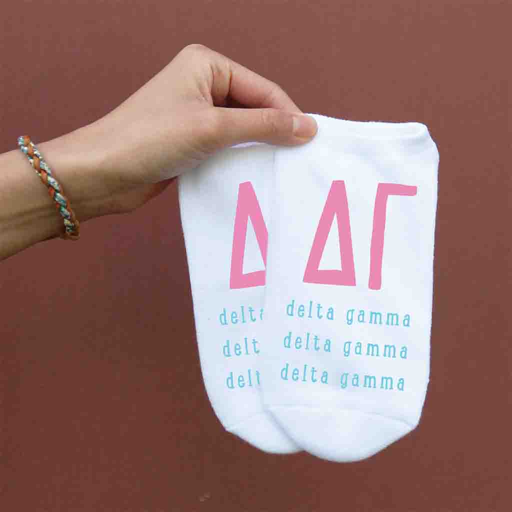 Delta Gamma sorority letters and name digitally printed on white no show socks.